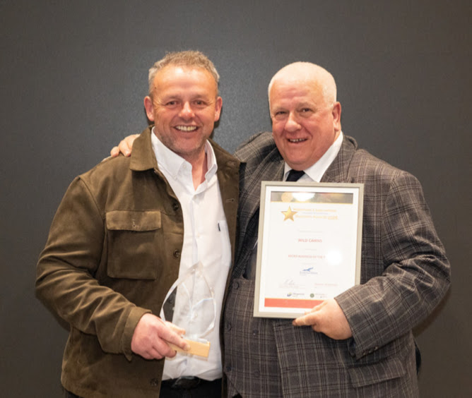 Wild Cairns owners Scott and Gus picking up their Micro business of the year award